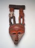 Triangular Mask Surmounted by Male and Female Figures