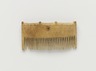 Comb Surmounted by Four Knobs