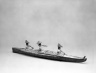 Model of Bidarka Boat with three seated figures