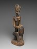 Figure of a Seated Musician (Koro Player)