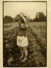 Jessy Park with Her Arms Raised in a Vegetable Garden, Williamstown, MA, from the Born Electrical Series