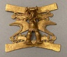 Gold Ornament in the Form of an Anthropomorphic Avian Figure Devouring a Fish
