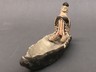 Figurine Seated in Canoe with Fish