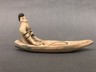 Figurine Seated in Canoe with Fish