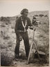 Navajo Indian looking at Camera on Tripod
