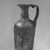 Roman. <em>Molded Jug</em>, 6th-early 7th century C.E. Glass, 7 3/16 x greatest diam. 3 1/16 in. (18.3 x 7.8 cm). Brooklyn Museum, Gift of Robert B. Woodward, 01.374. Creative Commons-BY (Photo: Brooklyn Museum, 01.374_bw_SL1.jpg)