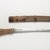 Ainu. <em>Sword with Carved Handle</em>, late 19th-early 20th century. Wood and steel, knife in sheath: 1 9/16 x 1 1/2 x 19 7/8 in. (4 x 3.8 x 50.5 cm). Brooklyn Museum, Gift of Herman Stutzer, 12.497a-b. Creative Commons-BY (Photo: Brooklyn Museum, 12.497_PS9.jpg)