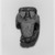  <em>Bes Amulet</em>, ca. 1836–1700 B.C.E. Faience, 1 1/4 x 13/16 x 3/8 in. (3.2 x 2.1 x 1 cm). Brooklyn Museum, Gift of Ariane, Nike, and Samara Mele, 1990.13. Creative Commons-BY (Photo: Brooklyn Museum, 1990.13_NegA_print_bw_SL5.jpg)