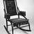 D. Dexter's Sons. <em>Rocking Chair</em>, patented May 18, 1880. Ebonized wood, gilt decoration, cast iron, original upholstery, 38 x 23 1/2 x 32 in.  (96.5 x 59.7 x 81.3 cm). Brooklyn Museum, H. Randolph Lever Fund, 1990.201. Creative Commons-BY (Photo: Brooklyn Museum, 1990.201_bw_IMLS.jpg)