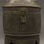 Asante. <em>Cylindrical Container with Domed Lid  (Forowa)</em>, 19th century. Hammered sheets of riveted copper alloy, height: 9 1/2 in. Brooklyn Museum, Gift of Shirley B. Williams, 1990.221.6a-b. Creative Commons-BY (Photo: Brooklyn Museum, 1990.221.6a-b_PS10.jpg)