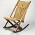 George Jacob Hunzinger (American, born Germany, 1835-1898). <em>Folding Rocking Chair</em>, ca. 1870. Walnut, brass, original upholstery, 31 3/4 x 17 7/8 x 29in. (80.6 x 45.4 x 73.7cm). Brooklyn Museum, George C. Brackett Fund, 1991.102. Creative Commons-BY (Photo: Brooklyn Museum, 1991.102_IMLS_SL2.jpg)