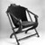 George Jacob Hunzinger (American, born Germany, 1835-1898). <em>Folding Chair</em>, ca. 1873. Wood, original upholstery, 31 5/8 x 27 1/2 x 29 1/4 in.  (80.3 x 69.9 x 74.3 cm). Brooklyn Museum, Gift of Norman K. Mizuno and Alan J. Davidson, 1995.153. Creative Commons-BY (Photo: Brooklyn Museum, 1995.153_view1_bw_IMLS.jpg)