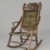 Attributed to Edward W. Vaill (1861-1891). <em>Rocking Chair</em>, ca. 1880. Wood, original woven upholstery, and metal, 39 3/4 x 23 7/8 x 30 1/2 in. (101 x 60.6 x 77.5 cm). Brooklyn Museum, Gift of Dr. Alvin E. Friedman-Kien, 2002.107.3. Creative Commons-BY (Photo: Brooklyn Museum, 2002.107.3_PS6.jpg)