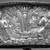 <em>Capital Cover with Crenelated Images of Gandharvas</em>. Repousse bronze with gilding, Approx.: 3 7/8 x 15 11/16 in. (9.8 x 39.8 cm). Brooklyn Museum, Gift of Dr. Alvin E. Friedman-Kien, 2004.112.36. Creative Commons-BY (Photo: Brooklyn Museum, 2004.112.36_detail.jpg)