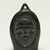 Samwillie Amidlak (1902-1984). <em>Janus-faced Amulet Head</em>, 1950-1980. Black stone, 2 3/4 x 1 7/8 x 3/4 in. (7 x 4.8 x 1.9 cm). Brooklyn Museum, Hilda and Al Schein Collection, 2004.79.19. Creative Commons-BY (Photo: Brooklyn Museum, 2004.79.19_view01_PS11-1.jpg)