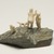 Inuit. <em>Scene: Two Men, a Child, and a Dog</em>, 1950-1980. Stone, ivory, 3 1/4 x 5 1/2 x 4 3/4 in. (8.3 x 14 x 12.1 cm). Brooklyn Museum, Hilda and Al Schein Collection, 2004.79.25. Creative Commons-BY (Photo: Brooklyn Museum, 2004.79.25_view03_PS11.jpg)