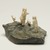 Inuit. <em>Scene: Two Men, a Child, and a Dog</em>, 1950-1980. Stone, ivory, 3 1/4 x 5 1/2 x 4 3/4 in. (8.3 x 14 x 12.1 cm). Brooklyn Museum, Hilda and Al Schein Collection, 2004.79.25. Creative Commons-BY (Photo: Brooklyn Museum, 2004.79.25_view04_PS11.jpg)