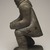 Thomasi Kaitak (1912-1977). <em>Figure of a Man Bending Over</em>, 1950-1980. Gray stone, bone, 13 x 5 x 7 in. (33 x 12.7 x 17.8 cm). Brooklyn Museum, Hilda and Al Schein Collection, 2004.79.64. Creative Commons-BY (Photo: Brooklyn Museum, 2004.79.64_left_PS11.jpg)