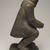 Thomasi Kaitak (1912-1977). <em>Figure of a Man Bending Over</em>, 1950-1980. Gray stone, bone, 13 x 5 x 7 in. (33 x 12.7 x 17.8 cm). Brooklyn Museum, Hilda and Al Schein Collection, 2004.79.64. Creative Commons-BY (Photo: Brooklyn Museum, 2004.79.64_right_PS11.jpg)