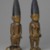 Yorùbá artist. <em>Pair of twin figures (Ère Ìbejì)</em>, late 19th-early 20th century. Wood, pigment, glass, metal, cotton, cowrie shells, a: 12 × 3 × 5 in. (30.5 × 7.6 × 12.7 cm). Brooklyn Museum, Gift of the Coltrera Collection, 2010.22.1a-b. Creative Commons-BY (Photo: Brooklyn Museum, 2010.22.1a-b_threequarter_PS6.jpg)