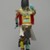 Henry Shelton (1929-2016). <em>Kachina Doll (Powaung Katsina)</em>, 1960-1970. Cottonwood root, acrylic paint, yarn,metal bells, feathers, leather, cotton, 14 1/2 × 5 × 6 1/2 in. (36.8 × 12.7 × 16.5 cm). Brooklyn Museum, Gift of Edith and Hershel Samuels, 2010.6.12. Creative Commons-BY (Photo: Brooklyn Museum, 2010.6.12_back_PS2.jpg)