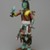 Henry Shelton (1929-2016). <em>Kachina Doll (Powaung Katsina)</em>, 1960-1970. Cottonwood root, acrylic paint, yarn,metal bells, feathers, leather, cotton, 14 1/2 × 5 × 6 1/2 in. (36.8 × 12.7 × 16.5 cm). Brooklyn Museum, Gift of Edith and Hershel Samuels, 2010.6.12. Creative Commons-BY (Photo: Brooklyn Museum, 2010.6.12_front_PS2.jpg)
