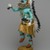 Orin Poley. <em>Kachina Doll (Sakwahote)</em>, 1960-1970. Cottonwood root, acrylic pigment, hide, feathers, shell, fur,  turquioise, metal, 17 3/4 x 6 x 9 in. (45.1 x 15.2 x 22.9 cm). Brooklyn Museum, Gift of Edith and Hershel Samuels, 2010.6.1. Creative Commons-BY (Photo: Brooklyn Museum, 2010.6.1_threequarter_left_PS2.jpg)