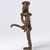 Ldamie (Dan, flourished 1920s–1930s). <em>Male Figure with Scythe</em>, early 20th century. Copper alloy, 8 1/16 x 3 15/16 x 3 15/16 in. (20.5 x 10 x 10 cm). Brooklyn Museum, Gift of Tom and Anna Boyle, 2012.75.4. Creative Commons-BY (Photo: Brooklyn Museum, 2012.75.4_side_left_PS22.jpg)