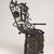 Gonçalo Mabunda (Mozambican, born 1975). <em>Harmony Chair</em>, 2009. Welded weapons (handguns, rifles, land mines, bullets, machine gun belts, rocket-propelled grenades), iron alloy, copper alloy, plastic, wood, and paint, 56 1/8 × 34 1/4 × 26 1/2 in. (142.6 × 87 × 67.3 cm). Brooklyn Museum, Bequest of Samuel E. Haslett, by exchange, gift of Mrs. Morris Friedsam, Georgine Iselin, and Mrs. Joseph M. Schulte, by exchange and Designated Purchase Fund, 2013.26.2. © artist or artist's estate (Photo: Brooklyn Museum, 2013.26.2_threequarter_PS9.jpg)