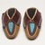 Delaware. <em>Youth Moccasins</em>, ca. 1900. Hide, cloth, beads, 4 1/4 × 1/8 × 7 3/8 in. (10.8 × 0.3 × 18.7 cm). Brooklyn Museum, Gift of the Edward J. Guarino Collection in memory of Edgar J. Guarino, 2016.11.3a-b. Creative Commons-BY (Photo: Brooklyn Museum, 2016.11.3a-b_view03_PS11.jpg)