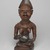 Yombe artist. <em>Figure of Mother and Child (Phemba)</em>, 19th century. Wood, glass, upholstery studs, metal, metal and glass buttons, resin, 11 x 5 x 4 1/2 in. (27.9 x 12.7 x 11.4 cm). Brooklyn Museum, Museum Expedition 1922, Robert B. Woodward Memorial Fund, 22.1138. Creative Commons-BY (Photo: , 22.1138_overall_PS9.jpg)