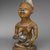 Yombe artist. <em>Figure of Mother and Child (Phemba)</em>, 19th century. Wood, glass, upholstery studs, metal, metal and glass buttons, resin, 11 x 5 x 4 1/2 in. (27.9 x 12.7 x 11.4 cm). Brooklyn Museum, Museum Expedition 1922, Robert B. Woodward Memorial Fund, 22.1138. Creative Commons-BY (Photo: Brooklyn Museum, 22.1138_threequarter_PS2.jpg)