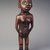 Kongo. <em>Standing Female Figure (Nkisi)</em>, 19th century. Wood, glass mirror, plastic beads, cotton cordage, applied materials, 9 x 2 3/4 x 2 1/2 in. (22.9 x 7.0 x 6.4 cm). Brooklyn Museum, Museum Expedition 1922, Robert B. Woodward Memorial Fund, 22.1444. Creative Commons-BY (Photo: Brooklyn Museum, 22.1444.jpg)