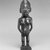 Kongo. <em>Standing Female Figure (Nkisi)</em>, 19th century. Wood, glass mirror, plastic beads, cotton cordage, applied materials, 9 x 2 3/4 x 2 1/2 in. (22.9 x 7.0 x 6.4 cm). Brooklyn Museum, Museum Expedition 1922, Robert B. Woodward Memorial Fund, 22.1444. Creative Commons-BY (Photo: Brooklyn Museum, 22.1444_bw.jpg)