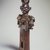 Yaka. <em>Slit-Drum Hunting Charm (N-kookwa Ngoombu)</em>, 19th century. Wood, iron, seedpods, fiber, horn, fur, glass, beads, organic material, 12 3/16 x 2 3/4 x 2 in. (31 x 7 x 5.1 cm). Brooklyn Museum, Museum Expedition 1922, Robert B. Woodward Memorial Fund, 22.1461. Creative Commons-BY (Photo: Brooklyn Museum, 22.1461.jpg)