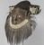 Kuba (Bushoong subgroup) artist. <em>Mask (Mwaash aMbooy)</em>, late 19th or early 20th century. Rawhide, paint, plant fibers, textile, cowrie shells, glass, wood, monkey pelt, feathers, 22 x 20 x 18 in. (55.9 x 50.8 x 45.7 cm). Brooklyn Museum, Museum Expedition 1922, Robert B. Woodward Memorial Fund, 22.1582. Creative Commons-BY (Photo: , 22.1582_threequarter_left_PS9.jpg)