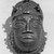 Edo. <em>Pendant Mask (Uhunmwu-Ẹkuẹ)</em>, 19th century. Copper alloy, 4 15/16 × 2 15/16 in. (12.5 × 7.5 cm). Brooklyn Museum, Museum Expedition 1923, Purchased with funds given by Frederic B. Pratt and Frank L. Babbott, 23.280. Creative Commons-BY (Photo: Brooklyn Museum, 23.280_acetate_bw.jpg)