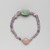  <em>Bracelet with Uninscribed Scarab</em>, ca. 1938–1875 B.C.E. Amethyst, feldspar, Overall Diam. 2 3/16 in. (5.5 cm). Brooklyn Museum, Gift of the Egypt Exploration Society
, 26.47. Creative Commons-BY (Photo: , 26.47_back_PS9.jpg)