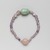  <em>Bracelet with Uninscribed Scarab</em>, ca. 1938-1875 B.C.E. Amethyst, feldspar, Overall Diam. 2 3/16 in. (5.5 cm). Brooklyn Museum, Gift of the Egypt Exploration Society
, 26.47. Creative Commons-BY (Photo: , 26.47_front_PS9.jpg)