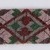 Menominee. <em>Beadwork Strip with blue, red and green wool twisted fringe</em>, 1900s. Beads, wool, 38 x 1 3/4 in.  (96.5 x 4.4 cm). Brooklyn Museum, Gift of Samuel E. Haslett, 28800. Creative Commons-BY (Photo: Brooklyn Museum, 28800_detail07_PS22.jpg)