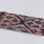 Menominee. <em>Beadwork Strip with blue, red and green wool twisted fringe</em>, 1900s. Beads, wool, 38 x 1 3/4 in.  (96.5 x 4.4 cm). Brooklyn Museum, Gift of Samuel E. Haslett, 28800. Creative Commons-BY (Photo: Brooklyn Museum, 28800_detail10_PS22.jpg)