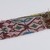 Menominee. <em>Beadwork Strip with blue, red and green wool twisted fringe</em>, 1900s. Beads, wool, 38 x 1 3/4 in.  (96.5 x 4.4 cm). Brooklyn Museum, Gift of Samuel E. Haslett, 28800. Creative Commons-BY (Photo: Brooklyn Museum, 28800_detail12_PS22.jpg)