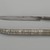  <em>Dagger and Sheath</em>, 1827. Iron alloy (steel) and copper alloy with gilding; sheath: copper alloy, chased and repoussé decoration, and wood lining
, Length of Knife: 16 in. (40.6 cm). Brooklyn Museum, Gift of the executors of the Estate of Colonel Michael Friedsam, 32.769a-b. Creative Commons-BY (Photo: Brooklyn Museum, 32.769_open_PS2.jpg)