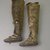 Inupiaq. <em>Man's Pair of Thigh-high Boots with red fabric decoration</em>, 1900-1930. Sealskin, wool, cloth, yarn, each ca. 29 x 11 1/2 x 5 3/4 in. or (80.5 x 28.5 cm). Brooklyn Museum, Frank L. Babbott Fund, 36.37a-b. Creative Commons-BY (Photo: Brooklyn Museum, 36.37a-b_side_PS5.jpg)