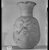  <em>Vase with Face of Bes on One Side</em>, 664-332 B.C.E. Clay, 6 3/4 × Diam. 4 1/8 in. (17.2 × 10.4 cm). Brooklyn Museum, Charles Edwin Wilbour Fund, 37.328E. Creative Commons-BY (Photo: Brooklyn Museum, 37.328E_NegE_SL4.jpg)