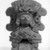 Zapotec. <em>Funerary Urn in Form of Seated Figure</em>, ca. 200-700. Gray clay, 10 1/2 × 8 1/4 × 5 3/8 in. (26.7 × 21 × 13.7 cm). Brooklyn Museum, Ella C. Woodward Memorial Fund, 40.714. Creative Commons-BY (Photo: Brooklyn Museum, 40.714_bw.jpg)