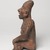 Jalisco. <em>Seated Figure of a Woman</em>, 300 BCE-300 CE. Ceramic, pigment, 10 × 6 1/2 × 5 3/4 in. (25.4 × 16.5 × 14.6 cm). Brooklyn Museum, Ella C. Woodward Memorial Fund, 40.919. Creative Commons-BY (Photo: Brooklyn Museum, 40.919_left_PS9.jpg)