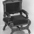 Possibly Solomon Fanning (American, 1790-1864). <em>Armchair (one of a pair with 44.24.3) Neo-Grec style</em>, ca. 1860-1862. Unidentified wood, walnut, metal, modern upholstery (reupholstered June 1989) Brooklyn Museum, Gift of Bertha Fanning Taylor, 44.24.2. Creative Commons-BY (Photo: Brooklyn Museum, 44.24.2_threequarter_view2_acetate_bw.jpg)