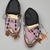 Blackfoot. <em>Pair of Men's Moccasins</em>, late 19th-early 20th century. Leather, beads, orange horse hair, tin, Each: 10 1/4 x 4 3/4 in. (26 x 12.1 cm). Brooklyn Museum, Charles Stewart Smith Memorial Fund, 46.96.9a-b. Creative Commons-BY (Photo: Brooklyn Museum, 46.96.9a-b_view2_PS2.jpg)