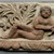 Coptic. <em>Frieze Fragment with Semi-Reclining Nude</em>, 4th-5th century C.E., with 20th century alterations. Limestone, pigment, 11 x 12 5/8 x 4 in. (28 x 32 x 10.2 cm)  . Brooklyn Museum, Charles Edwin Wilbour Fund, 55.2.2. Creative Commons-BY (Photo: Brooklyn Museum, 55.2.2_PS1.jpg)